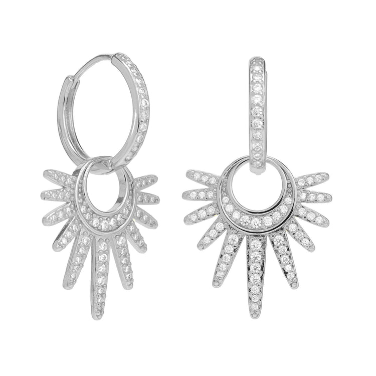 Silver hoop earrings with starburst design and cubic zirconia stones.