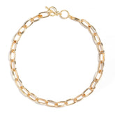Elegant gold link necklace with chunky 18k gold-plated stainless steel design and toggle clasp.