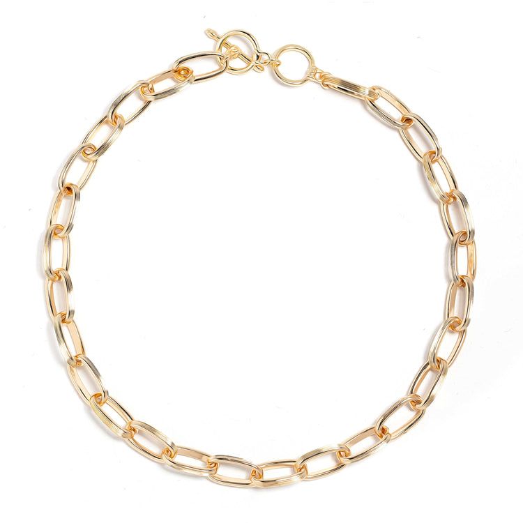 Elegant gold link necklace with chunky 18k gold-plated stainless steel design and toggle clasp.